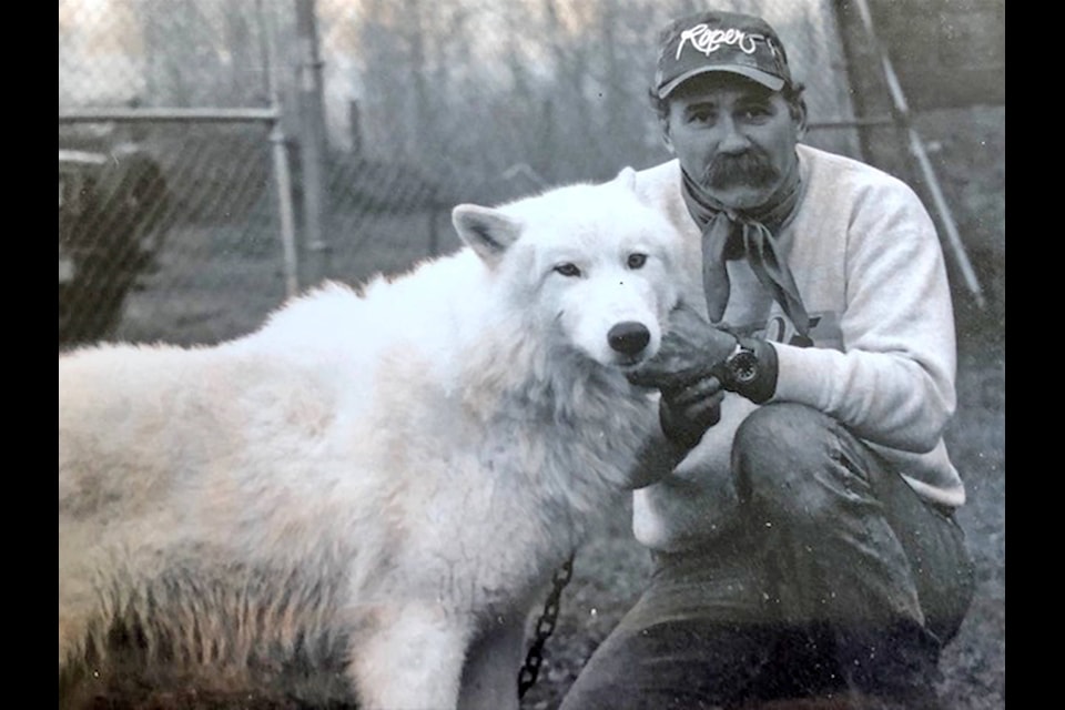 Lee Sollenberger poses with Babe, an Arctic Wolf he trained for a TV show back in 1997. “She didn’t like many people, but she loved me,” he said. (Photo submitted)