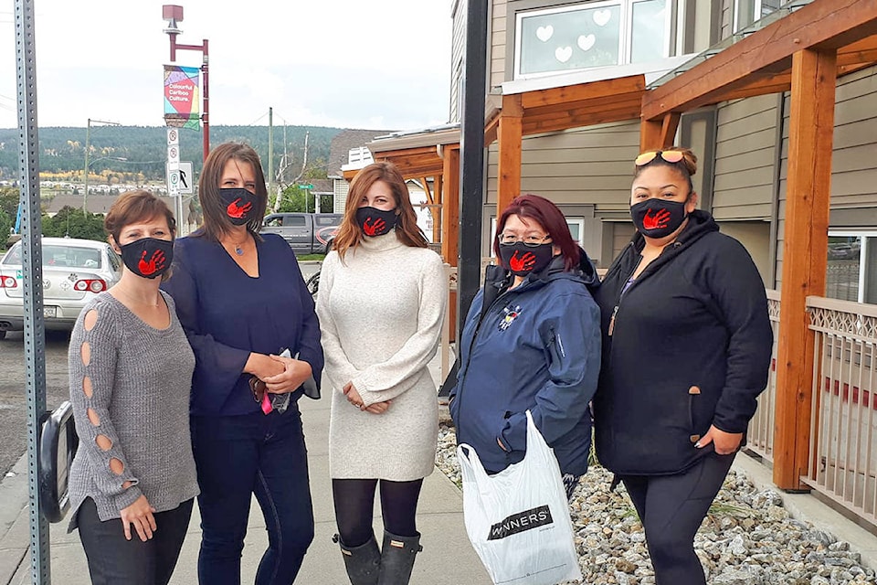 Tamara Garreau (from left), Lori Winters, Mary Borkowski-Sutton, Noella William, and Cynthia Dick don face masks made by Dana Alphonse of the Williams Lake First Nation. They will be honouring MMIWG through a Sisters in Spirit Vigil on Oct. 9 in Williams Lake, and ask the public to join them. (Rebecca Dyok photo)