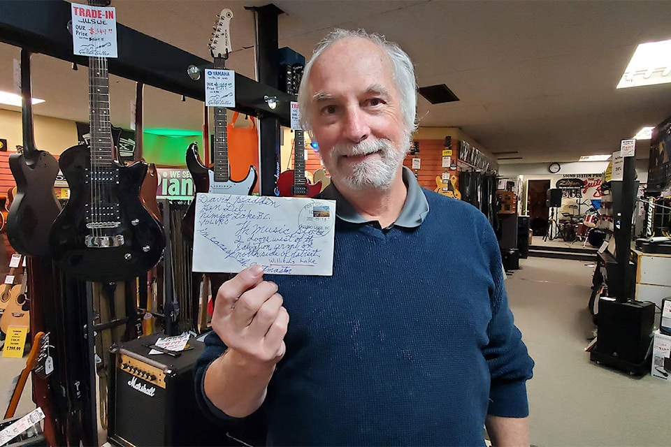 The Guitar Sellar’s owner Brian Sawyer holds up a creatively addressed letter he received recently at his music store in Williams Lake. (Monica Lamb-Yorski photo - Williams Lake Tribune)