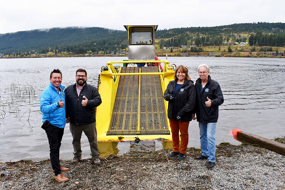 Williams Lake city councillors at the time Scott Nelson, left, Jason Ryll, Marnie Brenner and then Mayor Walt Cobb are excited to see the City’s new lake weed harvester ready to go in 2020. (Monica Lamb-Yorski photo - Efteen)