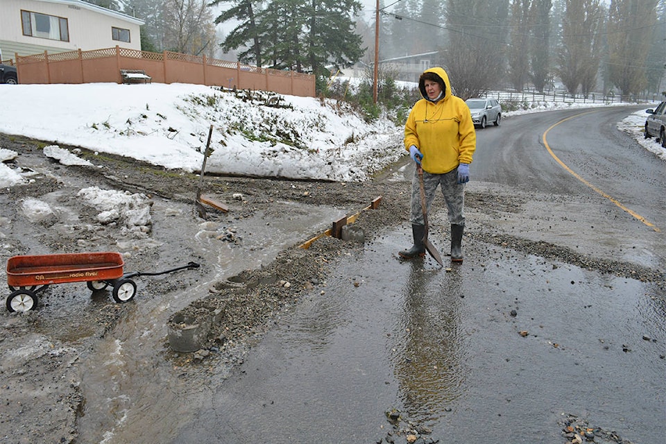 Roberts Drive resident Lisa Tarlings awoke at 6 a.m. Thursday, Oct. 29 to water roaring down the driveway. She and other residents began working to try and divert the water off the road into the ditch. (Monica Lamb-Yorski photo - Williams Lake Tribune.