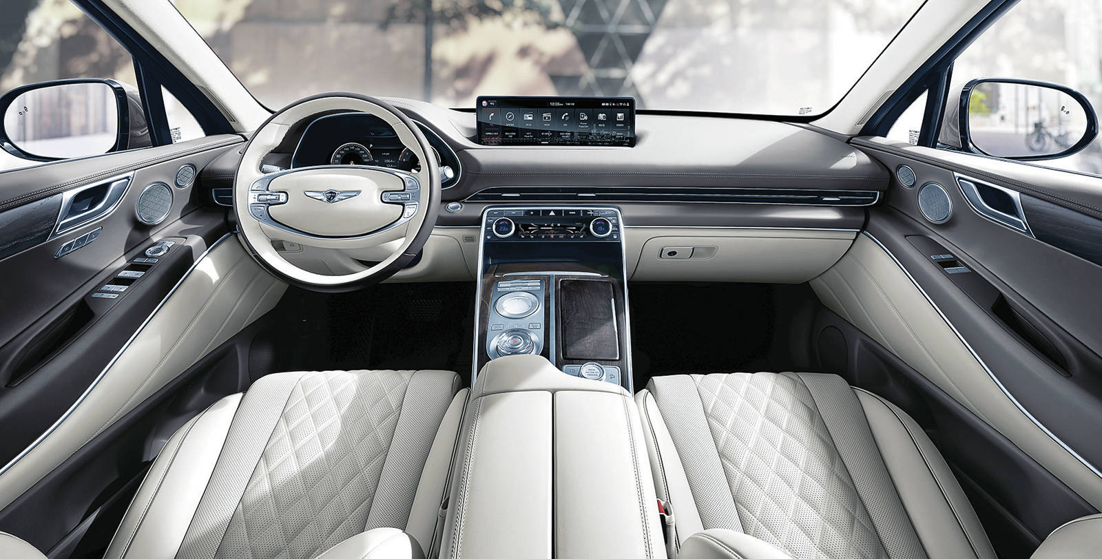 A wide 14.5-inch (diagonal) touch-screen hovers over the sleek and modern centre console, which is home to a dial gear selector for the standard eight-speed automatic transmission. PHOTO: GENESIS