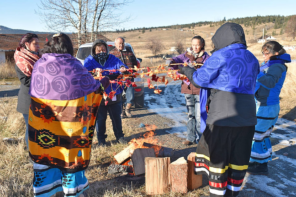 A dream catcher with 91 ties of tobacco was placed over a fire. The ties represent the 91 years St. Joseph’s Mission operated as a residential school. (Rebecca Dyok photo)