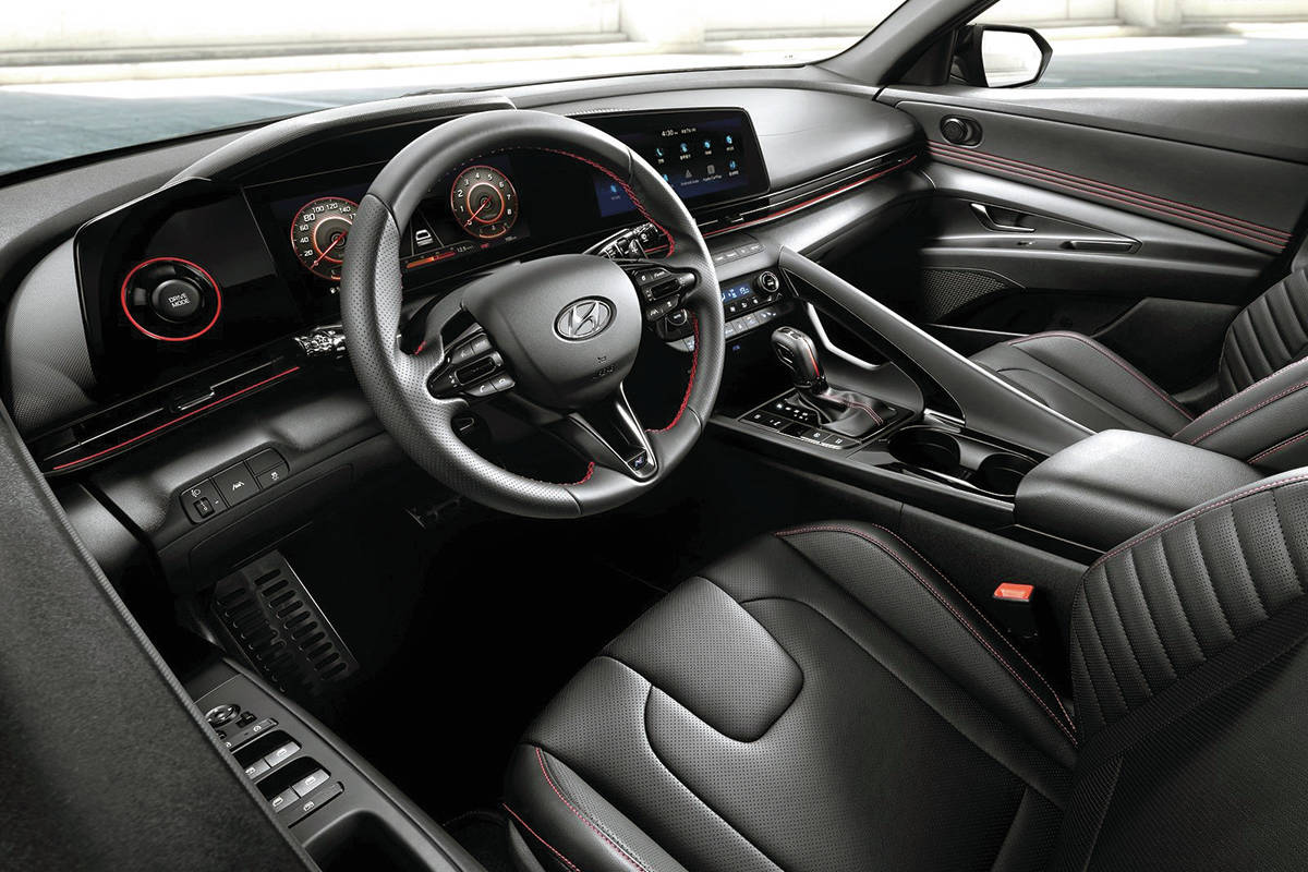 The Elantra interior is spectacular in its simplicity, with tidy screens and a traditional shift lever (no buttons or dial). This is the interior of the N Line, which starts at $30,500. PHOTO: HYUNDAI