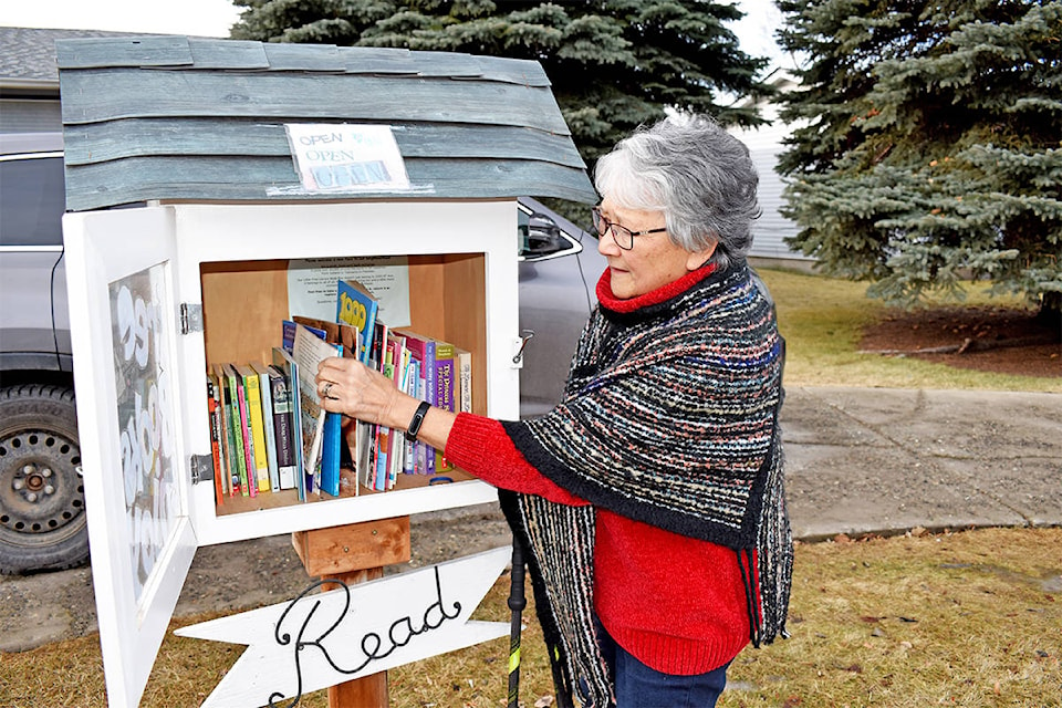 Aside from being a retired librarian and member of the Cariboo Chilcotin Partners for Literacy, Lil Mack advocates or literacy with her own little book box out front at her Ninth Avenue North home. (Monica Lamb-Yorski photo - Williams Lake Tribune)
