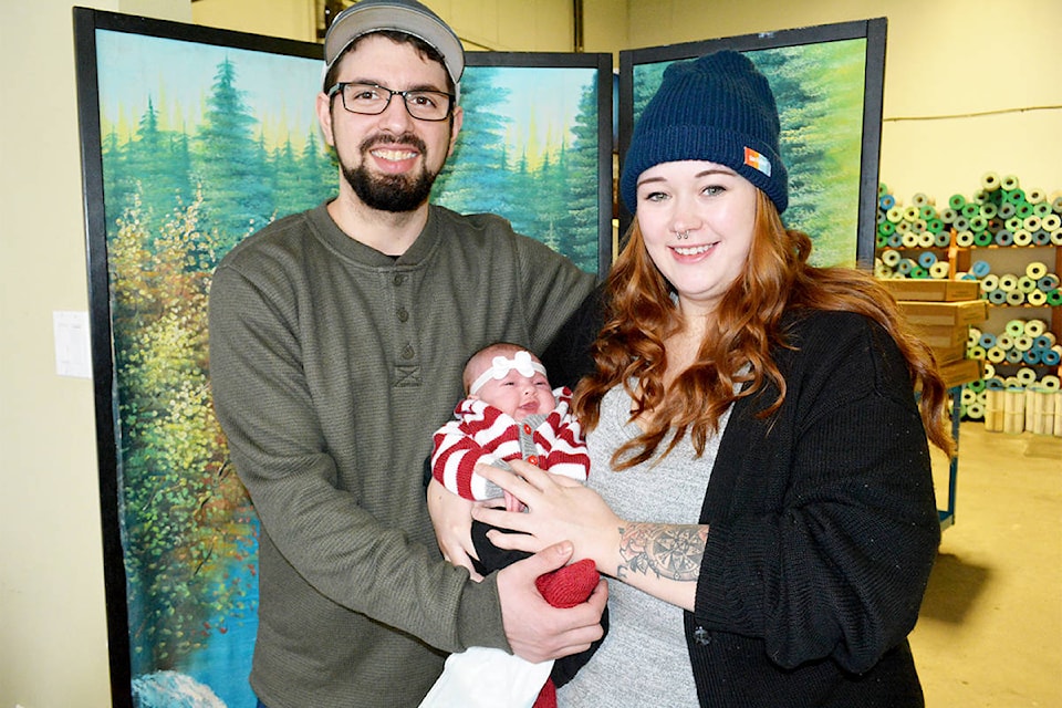 Williams Lake couple Laird Tutte, left, and Hilary Jones snuggle their daughter Adalina Evie Tutte who was born on New Year’s Day at Cariboo Memorial Hospital. (Monica Lamb-Yorski photo - Efteen)