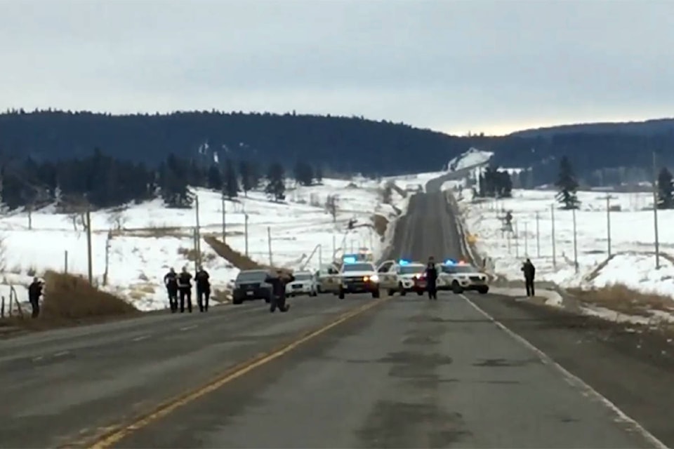 The RCMP arrest one of the suspects on Highway 97 courtesy of cell phone footage shot by a bystander. (April Thomas photo)