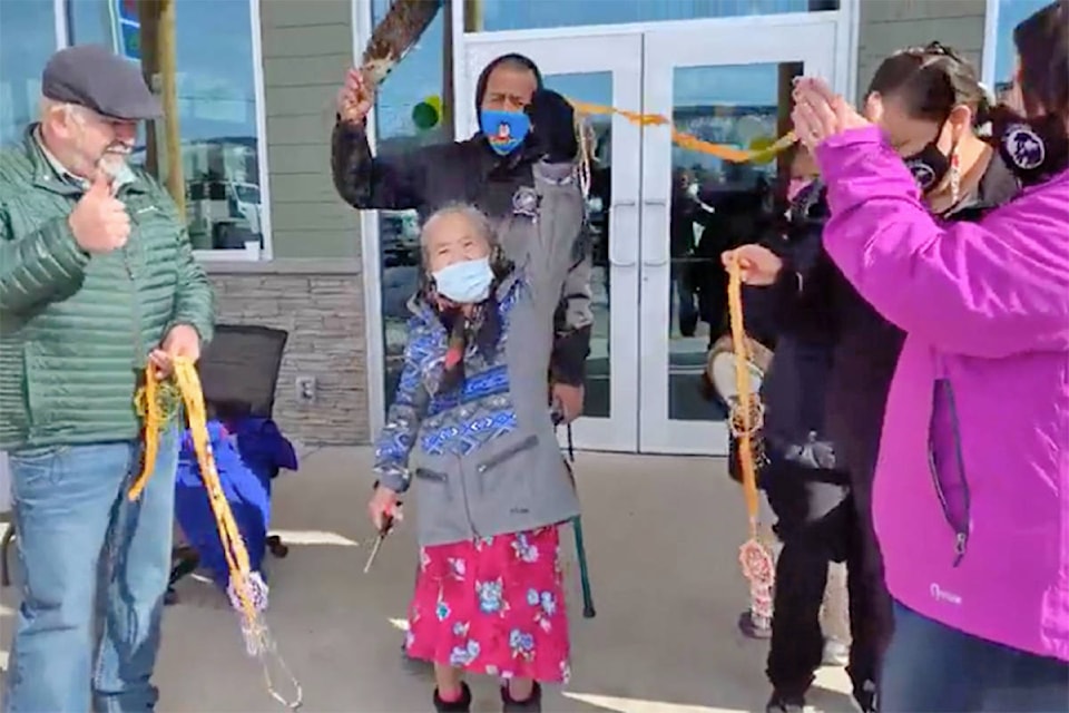 A string made of deer hide was cut by Tl’etinqox elder Melanie Bobby (centre) to mark the grand opening of Chilcotin River Trading Wednesday, March 3. (Chilcotin River Trading Facebook photo)