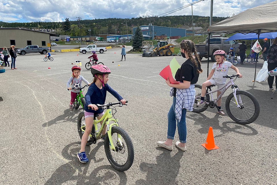Hannah, Hayley and Rylee Duff put their bike skills to the test at Dallas Ruyter’s station during the annual HUB International Bike Rodeo Sunday, May 2.