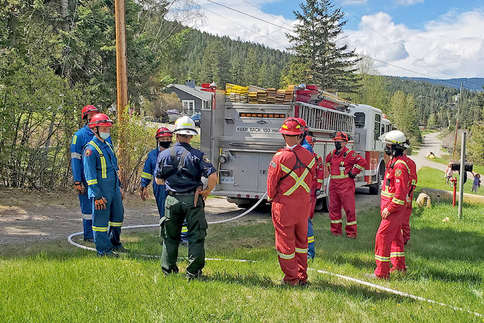 Firefighters prepare to do a mock scenario during wildfire interface training held in Williams Lake on Sunday, May 9. (Monica Lamb-Yorski photo - Williams Lake Tribune)