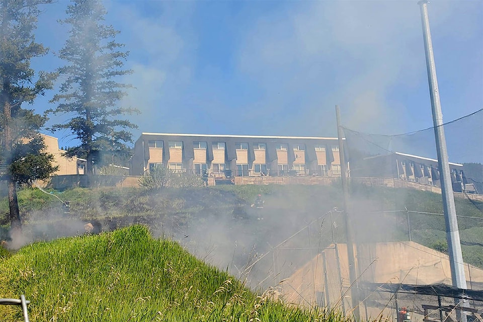 The Williams Lake Fire Department battles a grass fire off of Carson Avenue in Williams Lake Friday afternoon. (Monica Lamb-Yorski photo - Williams Lake Tribune)