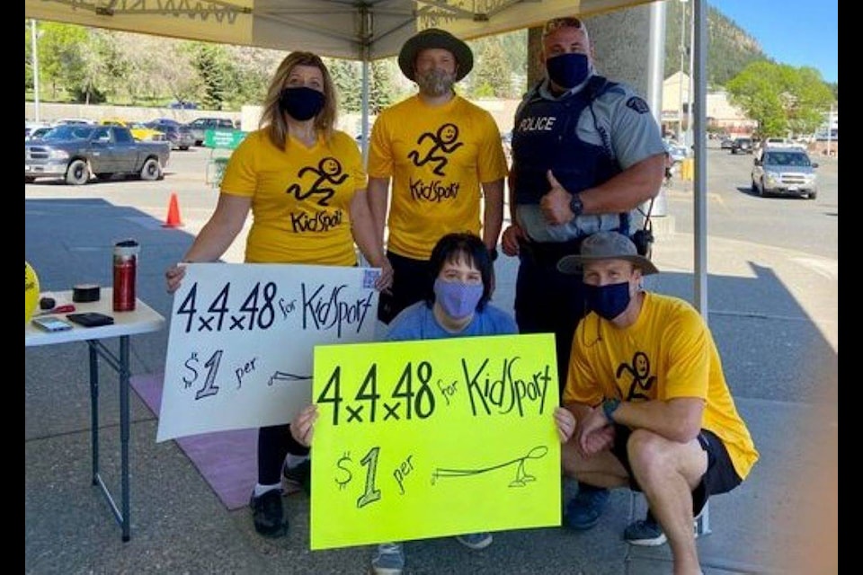 Williams Lake RCMP watch clerk Cynthia Colebank, from back left, Const. Dan Cohen, Const. Jay Pickering, centre, Williams Lake cell guard and Cpl. Fraser Bjornson were at Save-on-Foods Friday, May 21 where Bjornson and Cohen were doing push-ups to raise money for KidSport Williams Lake. (Photo submitted)