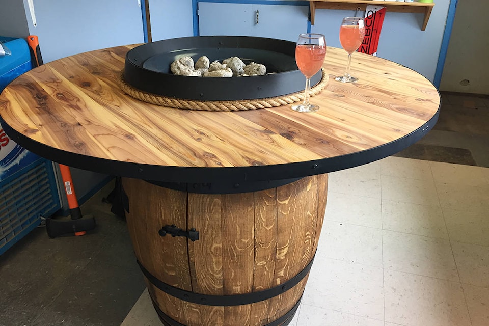 A patio fire pit custom-made from an oak barrel with a cedar top table is the first prize in the Horsefly Volunteer Department’s summer raffle. (Photo submitted)