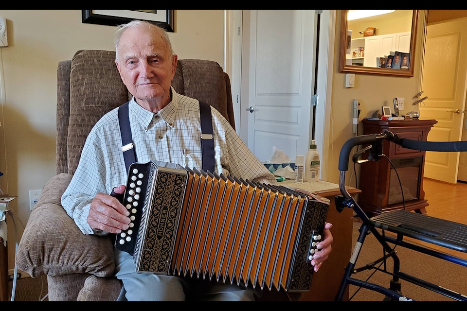 Rudy Johnson, 98, enjoys playing the accordion, and is often asked to play for the ladies at Seniors Village where he lives. (Monica Lamb-Yorski photo - Williams Lake Tribune)