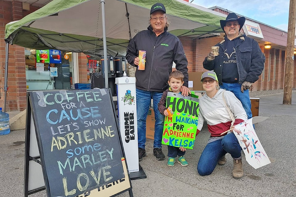 Cleanway staff Wendell Blois and Ken Kineshanko (back) with Jenn Stasica and her son, Ronan McConkey (front) greeted Handi-Mart customers early Friday, morning Oct. 15 as a fundraiser for Adrienne Kelso got underway. (Rebecca Dyok photo)