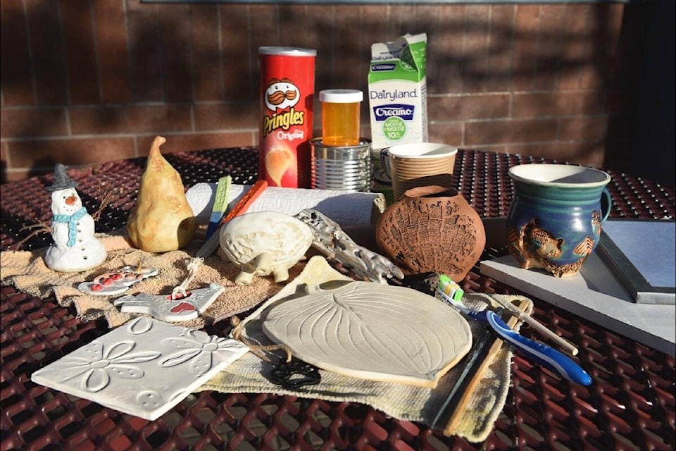 A display of some found and salvaged items used in making pottery as well as some pottery which made use of found and salvaged items to create unique pieces. (Ruth Lloyd photo - Williams Lake Tribune)