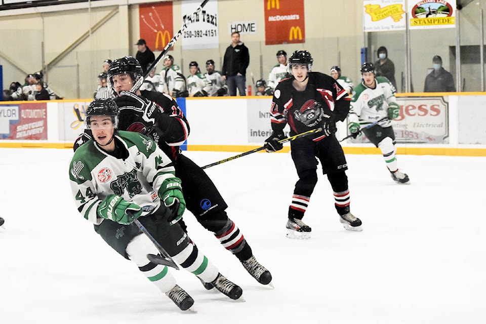 Williams Lake Stampeders defenseman Jaxon Passeri clears the puck with Prince Rupert Rampage’s John-Luc Fournier right behind him in Saturday night hockey action (Nov. 13) at the Cariboo Memorial Recreation Complex in Williams Lake. (Monica Lamb-Yorski photos - Williams Lake Tribune)