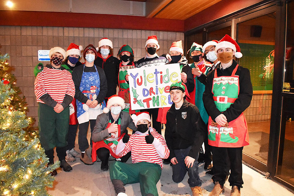 Williams Lake Minor Hockey Association Timberwolves U18 boys helped deliver dinners, stockings and teddy bears to vehicles as they arrived for the 24th Annual Yuletide Dinner, Wednesday, Dec. 8. (Monica Lamb-Yorski photo - Williams Lake Tribune)