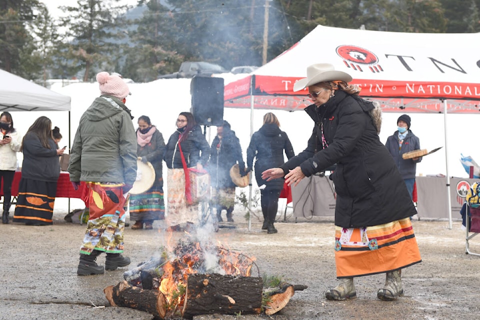 Roses and juniper were placed into the sacred fire as offerings at the Tsilhqot’in National Government South Lakeside office in Williams Lake after the announcement by WLFN of the preliminary findings of the St. Joseph’s Mission Residential School Investigation Tuesday, Jan. 25. (Ruth Lloyd photo - Williams Lake Tribune)