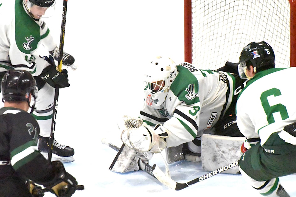 Williams Lake Stampeders goalie Willie Sellars makes another solid save in net, helping lead the team to victory before an appreciative crowd Saturday night. (Angie Mindus photo - Williams Lake Tribune)