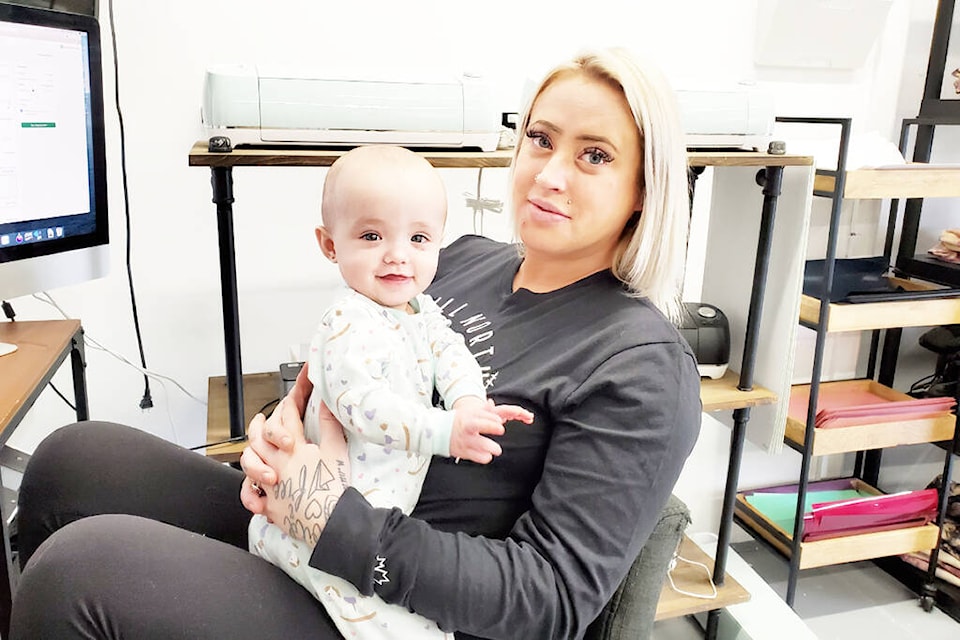 Still North Design Co. founder Courtney Vreeman often has her daughter Rallie-Ray, 9 months, with her at work as seen here Monday, Feb. 28. (Monica Lamb-Yorski photo - Williams Lake Tribune)