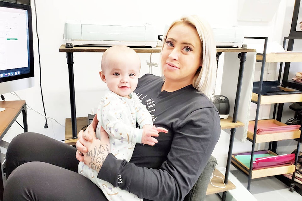 Still North Design Co. founder Courtney Vreeman often has her daughter Rallie-Ray, 9 months, with her at work as seen here Monday, Feb. 28. (Monica Lamb-Yorski photo - Efteen)