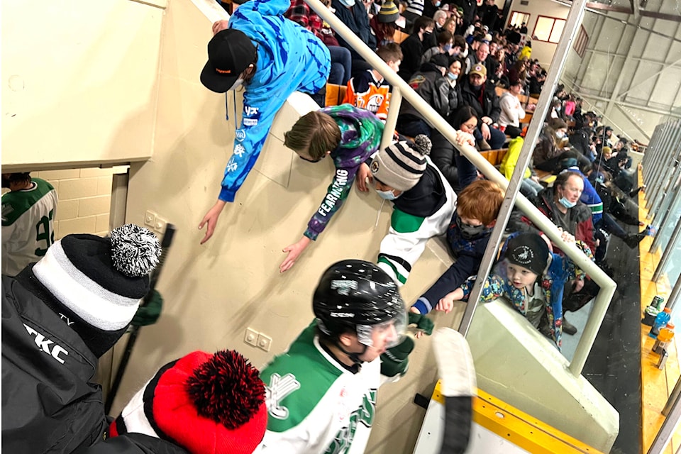 Young Williams Lake Stampeders fans reach out in hopes of a fist bump as players return to the ice after a break. The Stamps battled the Quesnel Kangaroos in Round Two of the CIHL playoffs March 4. (Angie Mindus photo - Williams Lake Tribune)