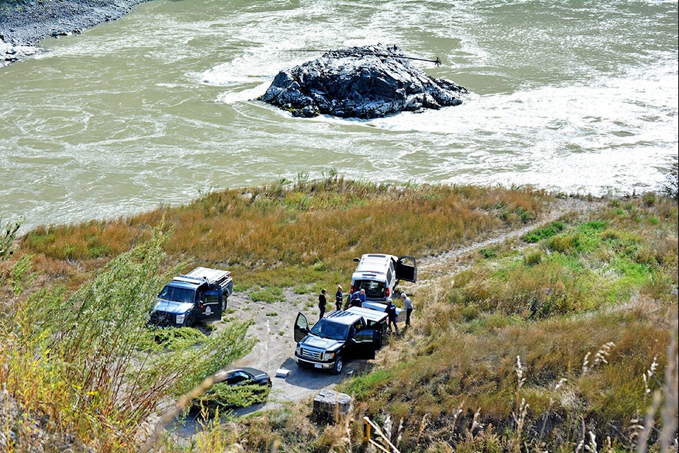 A body is recovered from the Fraser River near the Sheep Creek Bridge Tuesday, Aug. 27, 2019. (Monica Lamb-Yorski photo - Williams Lake Tribune)