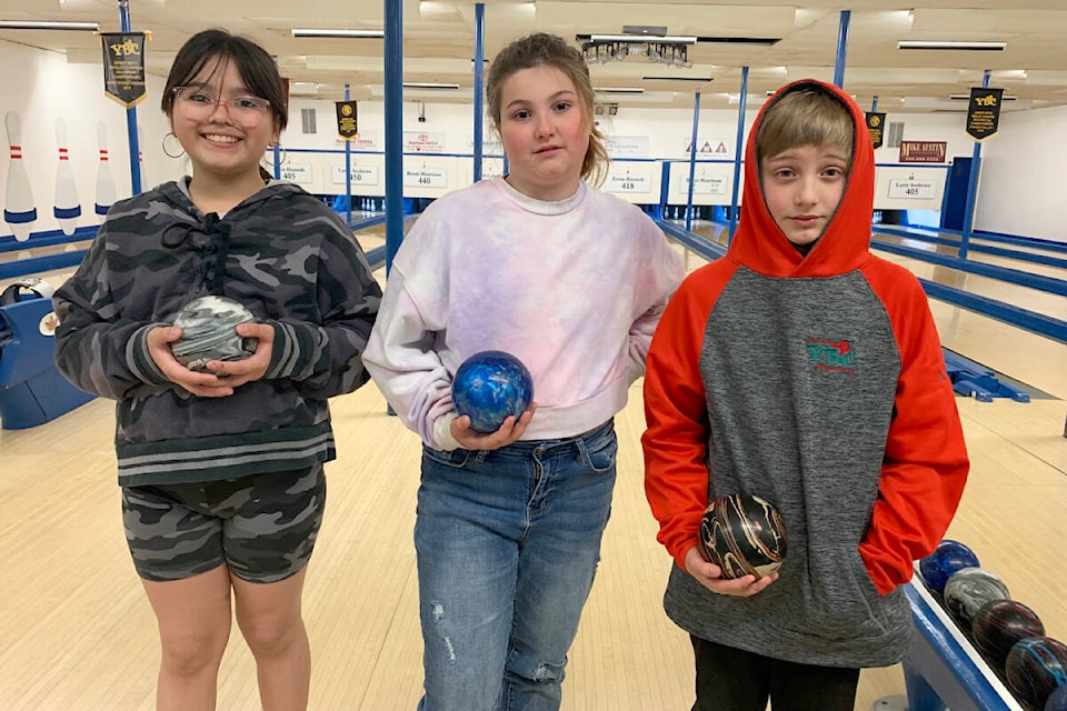 Mya Hunlin, from left, Lily Stewart, and Aiden Fischer, will be bowling in the five pin provincial championships in Surrey at the end of April as bantam single bowlers as part of Youth Bowl Canada competition. (Ruth Lloyd photo - Williams Lake Tribune)