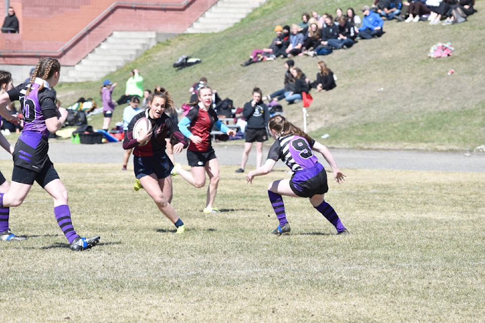 Lake City Secondary girls rugby team hosted a tournament Thursday, April 14. Here the senior girls Grace Turner, left, and Kalli Campbell go with the ball in a game against Nechako Valley Secondary. (Monica Lamb-Yorski photo - Efteen)