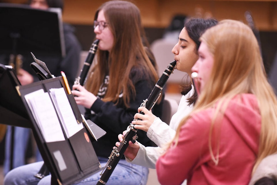 Senior concert band musicians Veronica Keats, from left on clarinet, Iknoop Bassi, also on clarinet and Heidi Van Beers on flute, practice in preparation for their final concert of the year. (Ruth Lloyd photo - Williams Lake Tribune)