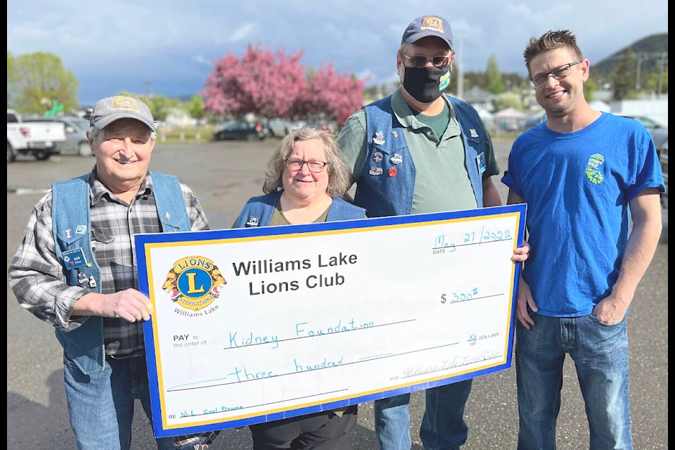Ron Erho, (from left) Chantal Lambert and Wilf Goerwell of the Williams Lake Lions Club present a cheque for $300 to Daniel Hutchings representing the Kidney Foundation. Hutchings encouraged residents to take part in the Kidney Walk being held virtually again this year. (Angie Mindus photo)