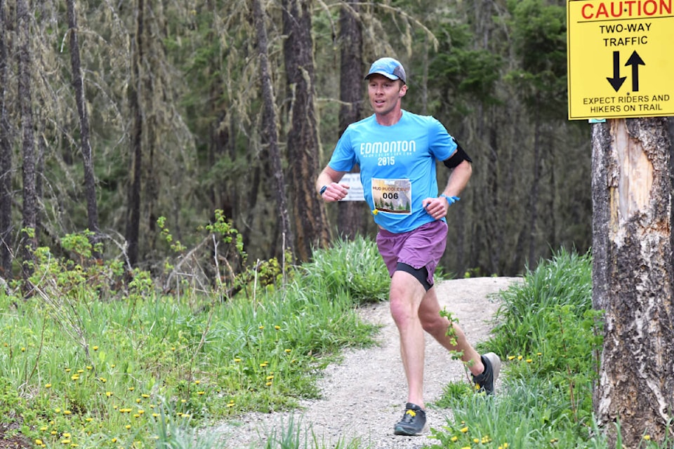Fraser Bjornson is the first runner to come in for the eight kilometre run with a time of 30 minutes and 30 seconds. (Angie Mindus photo - Williams Lake Tribune)