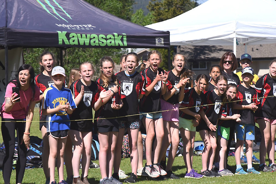 Students cheer on their teammates during the 2022 district track and field meet for children in Grades 4-6. The event was held in the fields at Columneetza and Nesika schools. (Angie Mindus photo - Williams Lake Tribune)