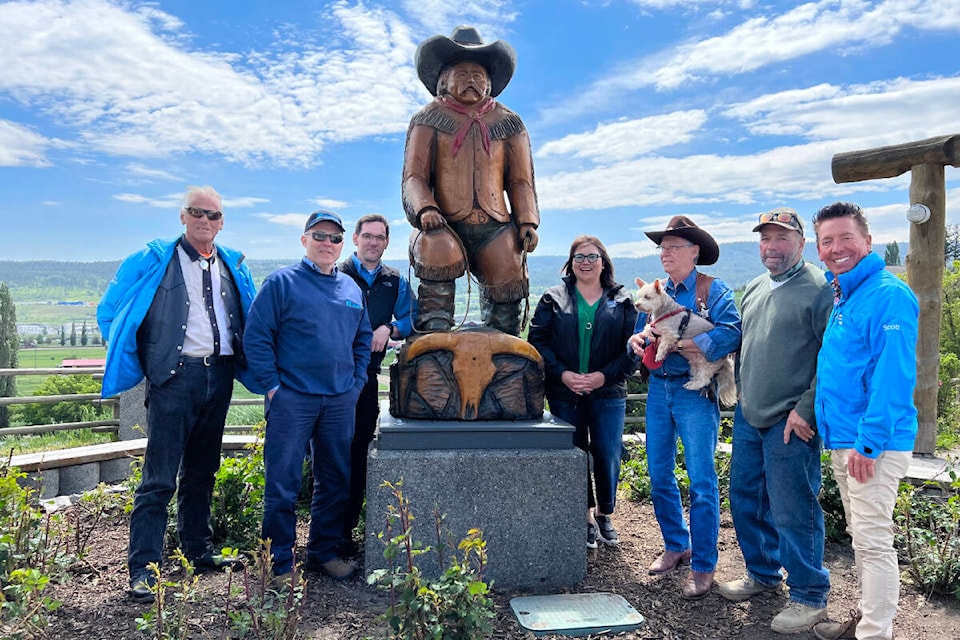 The city of Williams Lake installed the new Cow Boss statue above the Stampede Grounds Tuesday, June 15. Pictured above are; Coun. Ivan Bonnell (from left), Mark Blezard and Jacob Steyl of Atlantic Power, Coun. Marnie Brenner, Mayor Walt Cobb, carver Ken Sheen and Coun. Scott Nelson. (Angie Mindus photo - Williams Lake Tribune)