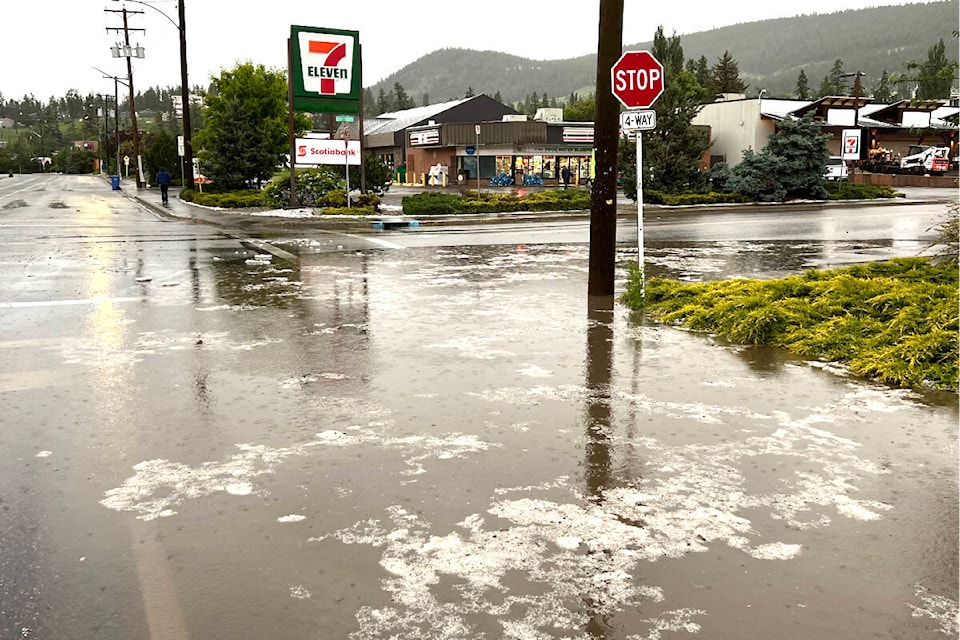 The storm drains had a hard time keeping up with the rain and hail storm. (Angie Mindus photo - Williams Lake Tribune)