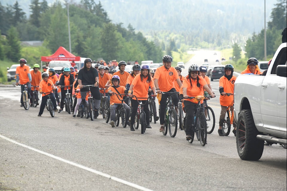 Cyclists were at the front of the group as Tl’etinqox and Yunesit’in riders came into town on June 29, 2022. (Ruth Lloyd photo - Efteen)