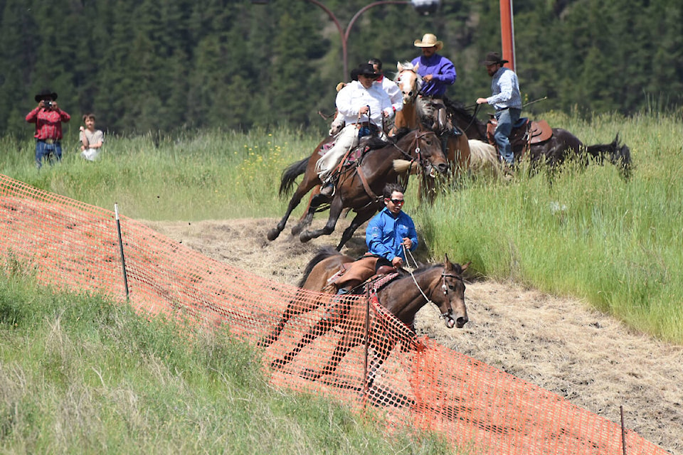 Steve Quilt races down the hill into the Stampede Grounds Friday (July 1). (Angie Mindus photo - Williams Lake Tribune)