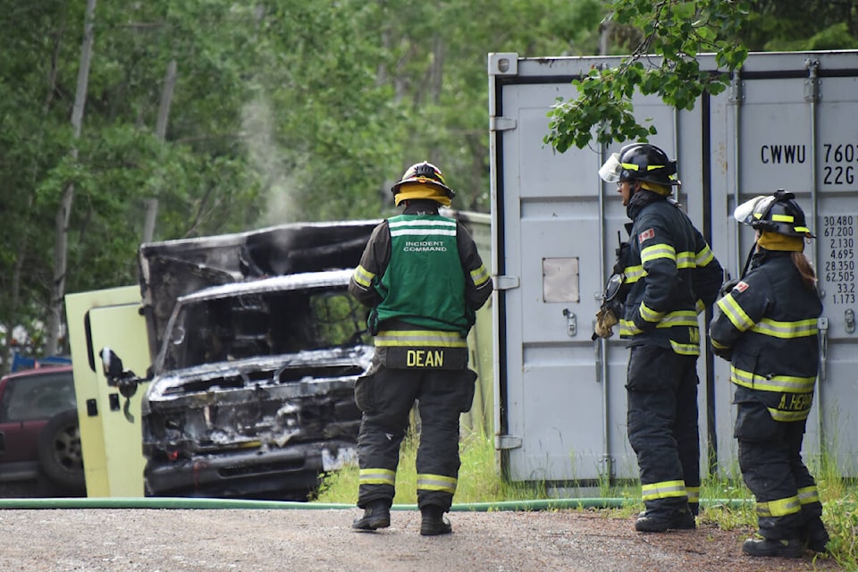 Members of the Williams Lake Fire Department wrap up their work after putting out a vehicle fire on a property behind Billy Bob’s Country Restaurant & Bar. (Angie Mindus photo - Wiliams Lake Tribune)