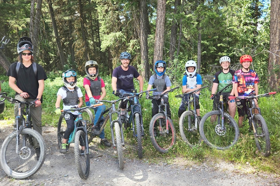 Michael Wijma, from left, Kalan Vath, Tobias Baumann, Tom Schoen, Rhys Vath, Caleb Engle, Charlie Gash and Olen Grady were all smiles after some trail work and trail riding at Soda Creek on July 25. (Dena Baumann photo)