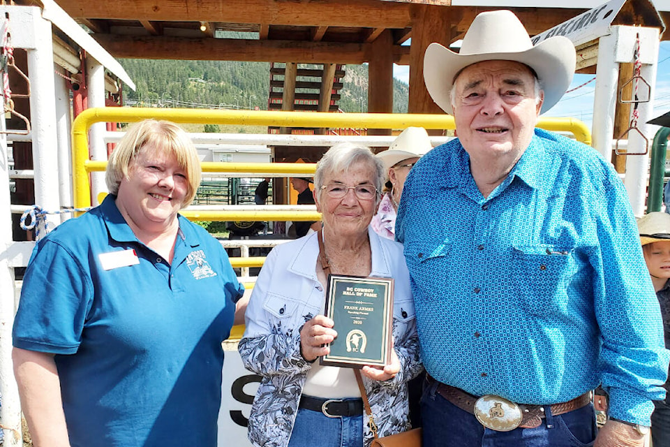 Kelly Walls presents the 2020 Cowboy Hall of Fame Ranching Pioneer Frank Armes plaque, accepted by the late Armes’ daughter Dot Unrau and son Gordon Armes.