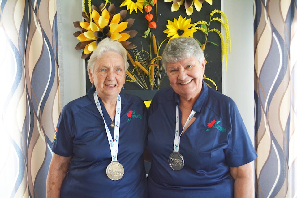 Bernie Inscho and Ingrid Vickers are proud of the silver medals they won playing crib at the Canada 55+ Games in Kamloops in August.