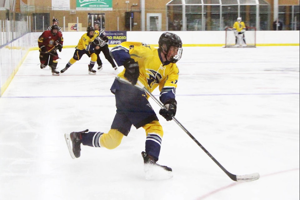 100 Mile House Wrangler Jackson Altwasser takes control of the puck during a game against the Dawson Creek Kodiaks. (Patrick Davies photo - 100 Mile Free Press)