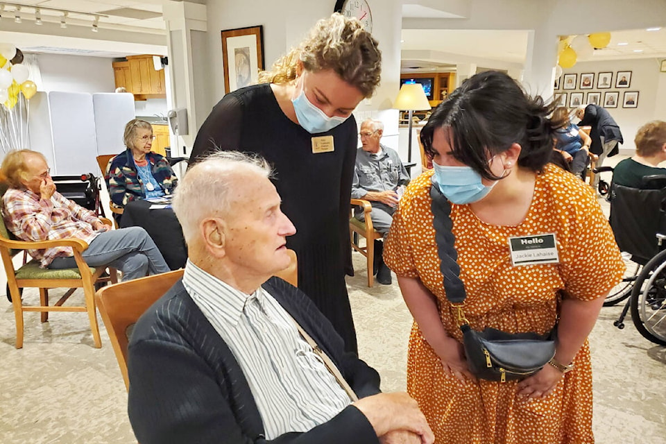 Seniors Village resident Rudy Johnson, left, and community relations manager Alex Froese chat with SD 27 trustee candidate Jackie Lahaise (right). (Monica Lamb-Yorski photo - Williams Lake Tribune)