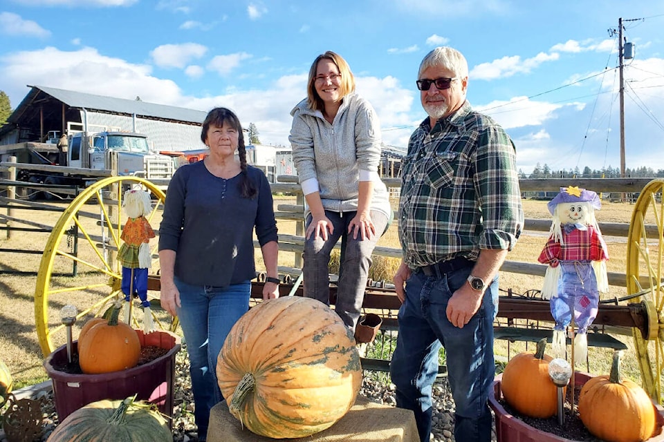 Halloween Festival co-ordinator Jazmyn Lyons, centre, received a donation from Karen Sepkowski, left, and Kim Sepkowski that will be used for a guess the weight of the pumpkin contest during the festival on Saturday, Oct. 29. (Monica Lamb-Yorski photo - Williams Lake Tribune)