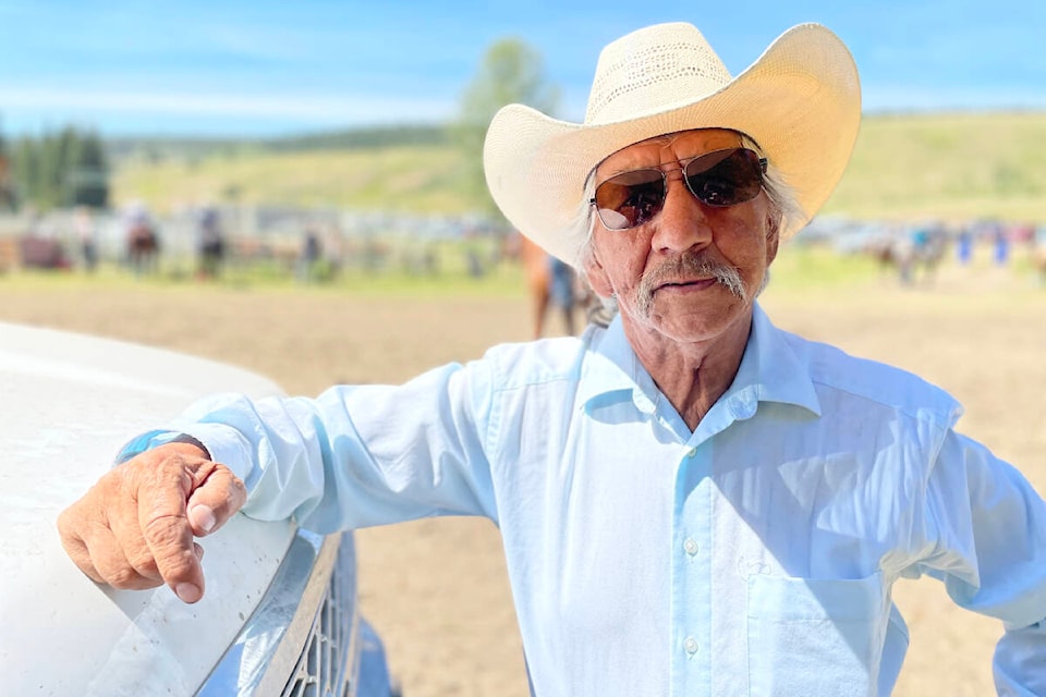 Bill Chelsea leans on the first aid truck in front of the rodeo grounds at Esk’et Rodeo as he takes a break from directing volunteers and organizing the event. (Ruth Lloyd photo - Williams Lake Tribune)