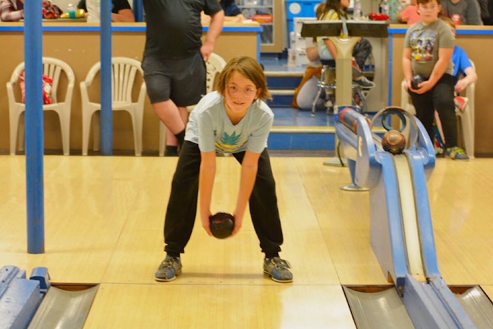 Jayla Gilbert, 8, prepares to throw the ball during youth bowling on a Monday in October. (Monica Lamb-Yorski photo - Williams Lake Tribune)