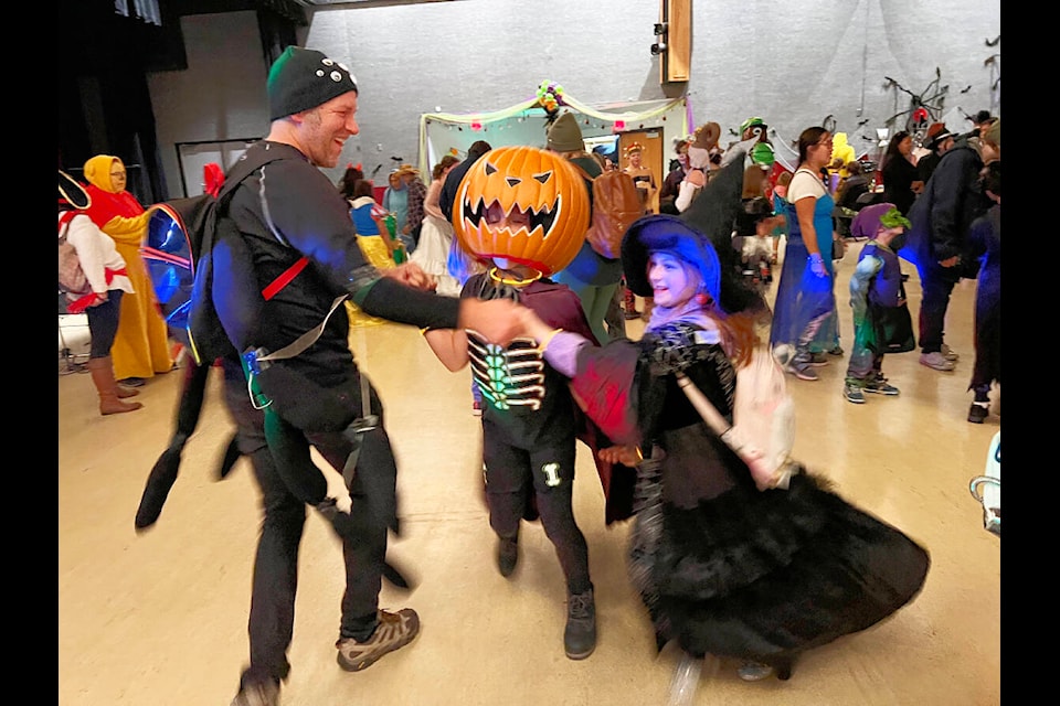 Jack Green busts a move with Layla Green and Ivy Halverson at the Halloween family dance held in the Gibraltar Room Saturday night. (Angie Mindus photo - Williams Lake Tribune)