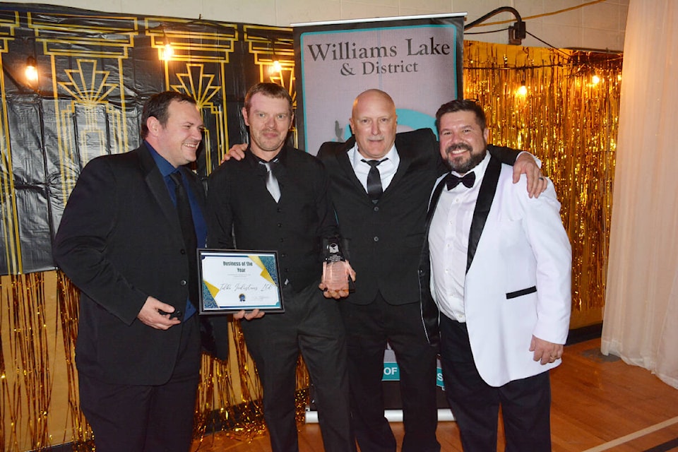 Tolko Industries Ltd. was named Business of the Year at the Williams Lake and District Chamber of Commerce Business Excellence Awards Saturday, Nov. 12. Posing with the award from Tolko are Jeff Green, safety and asset protection advisor, left, Jason Favel, plant manager and Ken Hunt, finishing and superintendent, along with Jason Ryll, chamber executive director. (Monica Lamb-Yorski photo - Williams Lake Tribune)