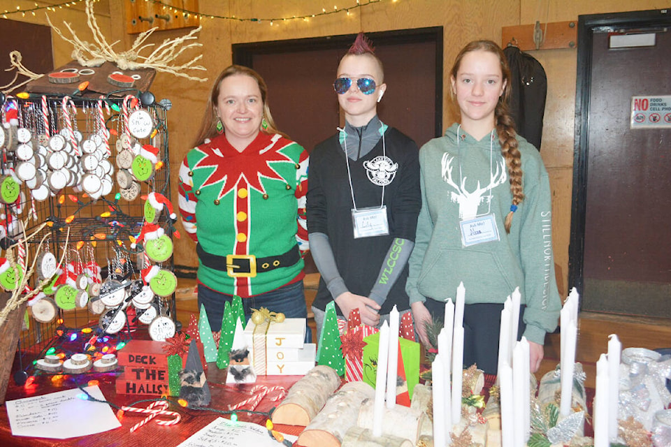 Cara Fraser and her twin daughters Lily and Alora were selling their handmade Christmas crafts at the Cariboo Hobby Con and Market. (Monica Lamb-Yorski photo - Williams Lake Tribune)